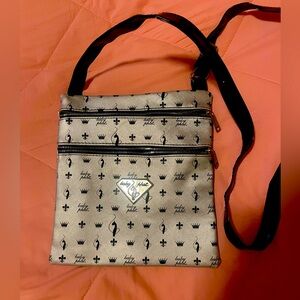 ⭐️BRAND NEW⭐️ BabyPhat crossbody black and silver purse. Never used. No callouts